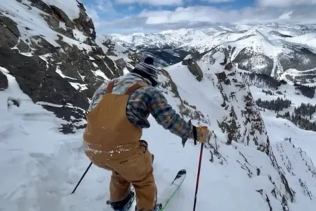 USA NEWS TODAY: Eric Page skiing down a snow-covered slope with confident speed and style, capturing the spirit of his passion and legacy on the mountain.