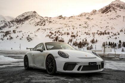 Porsche 911 Carrera Coupe Reimagined by Singer: A Perfect Fusion of Performance and Heritage 12 "Custom Porsche 911 Carrera Coupe Reimagined by Singer, showcasing sleek carbon fiber bodywork, upgraded suspension, and bespoke interior details, blending classic Porsche design with modern engineering."