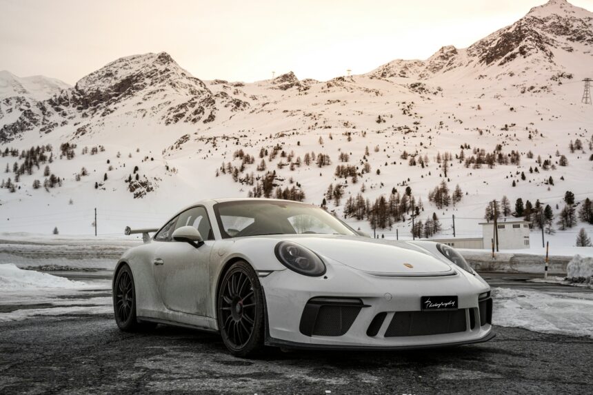 Porsche 911 Carrera Coupe Reimagined by Singer: A Perfect Fusion of Performance and Heritage 1 "Custom Porsche 911 Carrera Coupe Reimagined by Singer, showcasing sleek carbon fiber bodywork, upgraded suspension, and bespoke interior details, blending classic Porsche design with modern engineering."