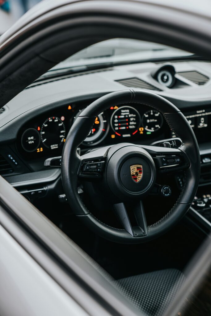Porsche 911 Carrera Coupe Reimagined by Singer: A Perfect Fusion of Performance and Heritage 2 "Interior of the Porsche 911 Carrera Coupe Reimagined by Singer, featuring hand-stitched leather seats, custom-built gauges, and a modern, luxurious design tailored to the owner's specifications."